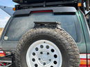 Back of a vehicle with a spare tire mounted on the back
